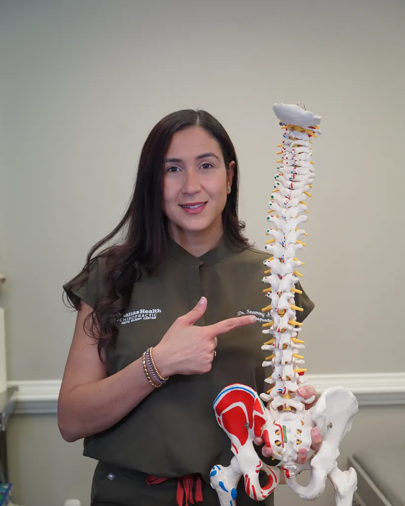 Dr. Soammy Matias explaining spinal alignment for neck and back pain relief in Tucker, GA